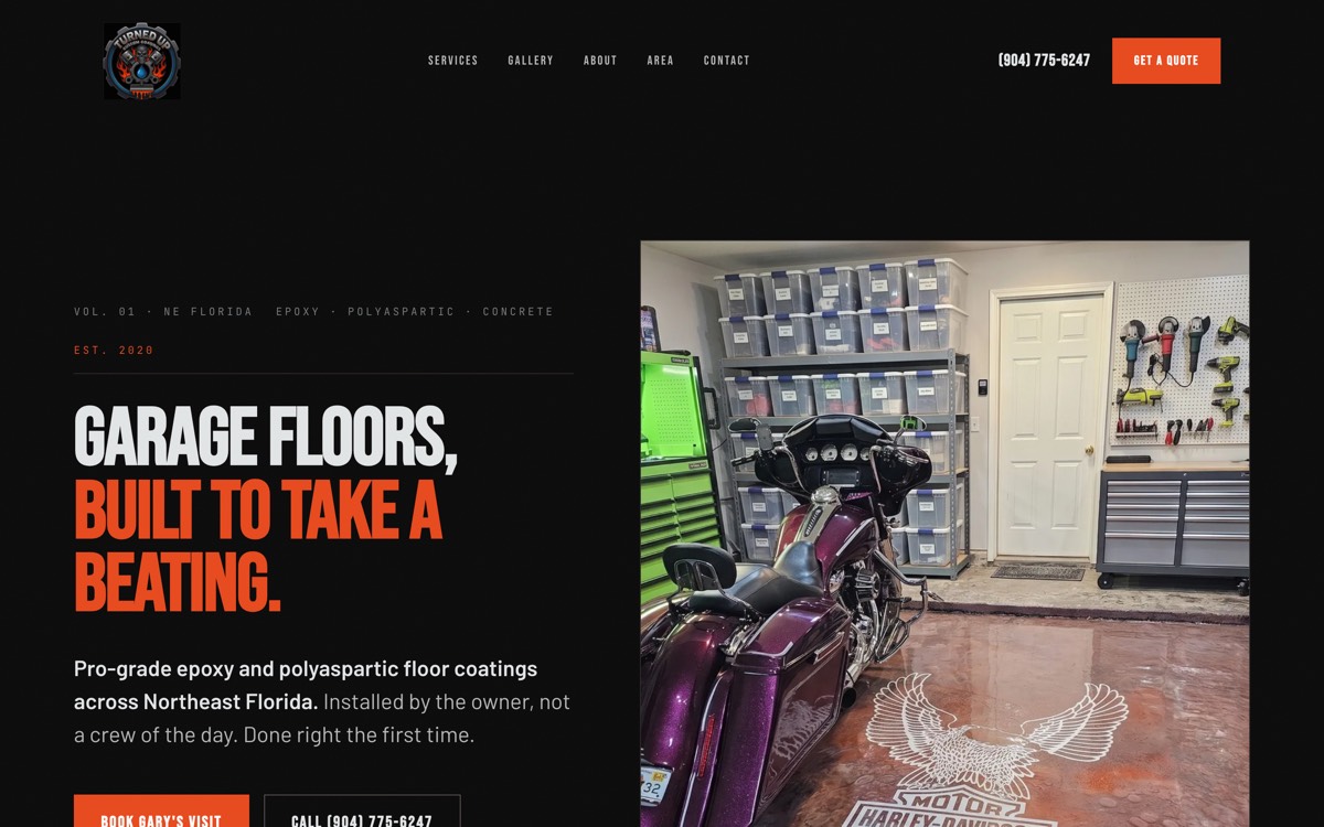 The Turned Up Custom Coatings homepage, a motorcycle on a finished epoxy garage floor